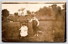 Platteville WI~Farm Boy Bibs~Lil Girl Rocking Chair~H Magee Shullsburg~RPPC 1910 picture