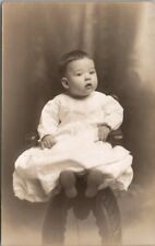 Cute Baby Perked Up for the Photo Dark Hair Postcard U2 picture