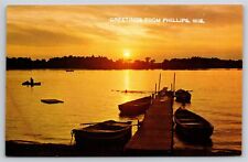 Rowboats On Pier Phillips Wisconsin~Vintage Postcard picture
