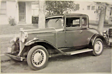 1931 PONTIAC COUPE parked on a street at the curb, b&w photo, 3 3/4