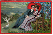 ANTIQUE EMBOSSED VALENTINE Postcard   MAN WITH ARM AROUND LADY, SITTING ON BENCH picture