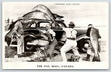 Le The Pas MB~Four Men Load Exaggerated Fish Catch Onto A 1940s Automobile~1954 picture