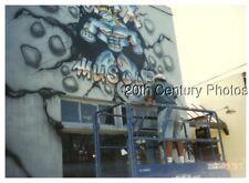 FOUND COLOR PHOTO J+7495 VIEW BEHIND MAN PAINTING MURAL ON BUILDING picture