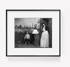 ca. 1900-10 photograph of Woman and 2 children watching bird fly from cage picture