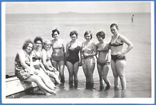 Group of beautiful girls in swimsuits on the beach Vintage photo picture