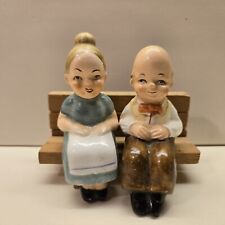 Vintage Old Man and Woman Husband Wife Sitting on Bench Salt and Pepper Shakers picture