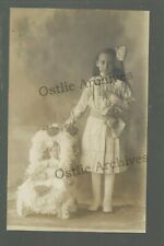 RPPC c1910 GIRL posing with DOLL Sitting in CHAIR in STUDIO SHOT Cute HUGE DOLL picture