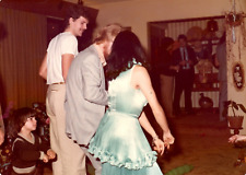 Found Photo Mystery Woman Funny Dance Men 1970s Original Photo picture