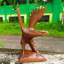 Wooden eagle statue. wooden flying eagle. Eagle statue flapping its wings picture