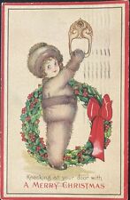 CHRISTMAS POSTCARD C.1923 (M55)~YOUNG CHILD WITH WREATH picture