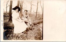 RPPC - Young Couple sitting on Log - 1909 Real Photo Postcard picture