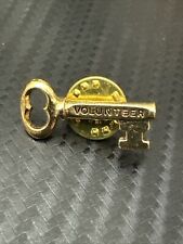Vintage Gold Tone Volunteer Key Lapel Pin picture