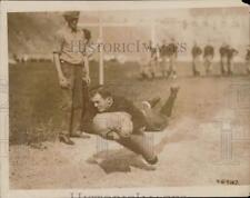 1920 Press Photo Syracuse quarterback Cowell tackling a dummy at practice. picture