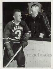 1956 Press Photo Howard Lee talks with hockey Coach Bun Cook - nei52634 picture
