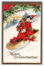 1911 Christmas Sledding With Poinsettia Flowers Fantasy Canoe Embossed Postcard picture