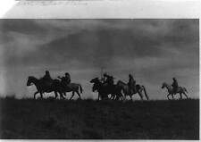 Indian scouts on horseback passing under cover of night,c1913,Central Plains picture