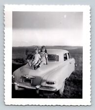 Two Young Girls Sit On The Back Of Classic Car Smiling VINTAGE Photo 3x3.5