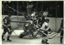 1993 Press Photo Univ of Wisconsin hockey player knocks over net in Denver game. picture