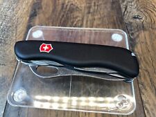 Pre-Owned VICTORINOX SWISS ARMY RESCUE TOOL POCKET KNIFE BLACK ONE HAND TREKKER picture