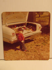 VINTAGE FOUND PHOTOGRAPH COLOR ART OLD PHOTO 1981 TODDLER GIRL MESSY CAR TRUNK picture