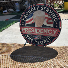 2024 PRESIDENCY PROUDLY SERVING THE PEOPLE 11.75-INCH PORCELAIN GAS & OIL SIGN picture