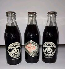 Lot of 3 - Vintage Coca Cola 75th Anniversary Bottles - Buffalo(2) & Meridian(1) picture