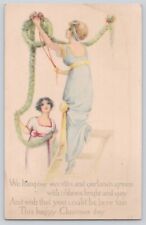 Postcard Christmas Beautiful Ladies Hanging Wreaths Garlands Antique 1914 picture