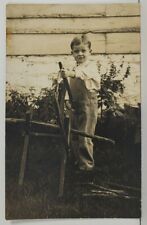 RPPC Adorable Young Boy Sawing Cutting Branches c1910 Postcard P7 picture