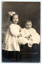 1912 Little Girl And Baby Studio Smith Mill Minnesota MN DPO RPPC Photo Postcard picture