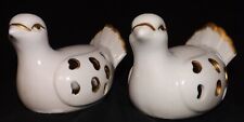 Porcelain dove figurines. Small white with gold accent hearts on the side.  picture