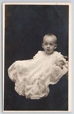 RPPC Wide-Eyed Blonde Haired Baby in Studio c1910 Real Photo Postcard picture