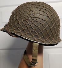 WW2 U.S. M1 HELMET FIXED BAIL HAS ORIGINAL LINER LEATHER CHINSTRAP AND NETTING picture