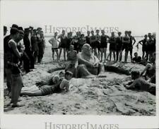 1979 Press Photo Bathers gathered with a sand sculpture at McKinley Beach, WI picture