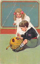 1911 Boy & Girl Carving Jack O Lantern Joyful Halloween post card as is picture