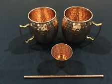 Set of two copper mugs ; one copper shot cup; and one copper straw picture