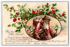 c1905 Christmas Santa Claus Brown Robe Basket Of Toys Holly Unposted Postcard picture