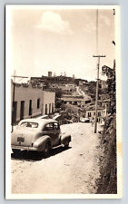 Photograph Vintage Automobile Snapshot Car Driving On Hill Landscape Buildings picture