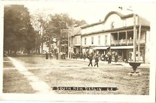 South New Berlin NY -- stores, street band, residents; nice 1913 RPPC picture