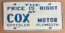 1960's THE PRICE IS RIGHT AT COX MOTOR CHRYSLER PLYMOUTH BOOSTER License Plate picture