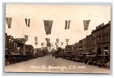 Postcard RPPC Brookings South Dakota Main Street Scene Old Cars Patriotic picture