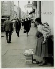 1971 Press Photo Mom Sells Wares on Street While Child Sleeps on Her Back, Peru picture