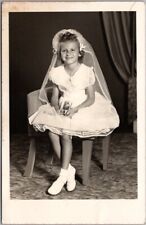 c1950s RPPC Photo Postcard Girl in White Confirmation Dress, Holding Jesus Card picture