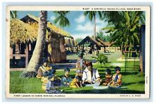 1934 A Seminole Indian Village, Canoe Making Lesson Florida FL Cancel Postcard picture