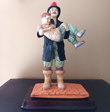 Vintage Figurine 1989 Fireman Rescuing Child Collectible Gift 9.5” A.E.P. Inc picture