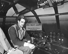 HOWARD HUGHES IN THE COCKPIT OF THE 