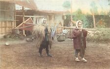 c1910 Hand-Colored Postcard JAPAN Peasants w Household Goods on Pole, Straw Cape picture