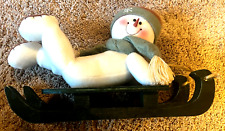 Plush snowman on a green Wooden Sled Christmas Decoration picture