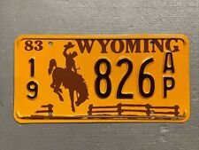 VINTAGE 1983 WYOMING LICENSE PLATE BUCKING BRONCO /FENCE 19-826AP MINT🤠 picture