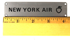 New York Air, galley nameplate, Ships Free  picture