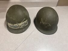 USED MILITARY SURPLUS 2 VINTAGE HELMETS WITH STRAPS picture